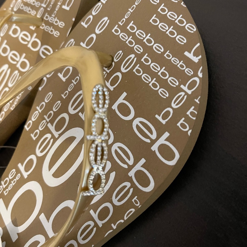 BEBE gold jeweled flip flops